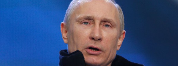 Putin addresses the audience during a rally and a concert called "We are together" in Moscow