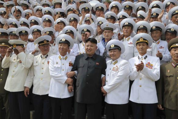 North Korean leader Kim Jong Un poses with officers and sailors of KPA Naval Unit 167