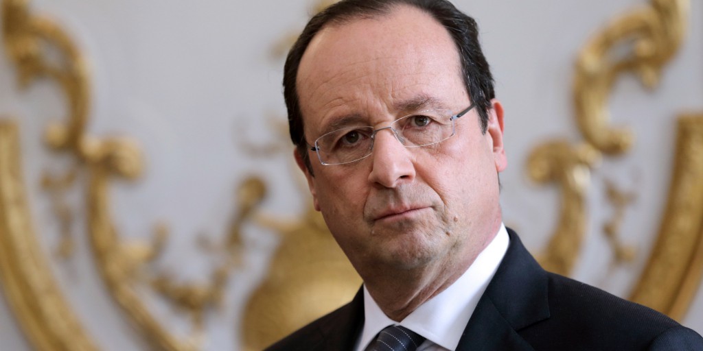 French President Francois Hollande listens to the speech of French Prime Minister during a new year ceremony with members of the government at the Elysee Palace in Paris on January 3, 2014.    AFP PHOTO / POOL / PHILIPPE WOJAZER        (Photo credit should read PHILIPPE WOJAZER/AFP/Getty Images)