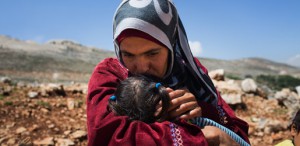 Syrian refugee Lina lives in a tented settlement with her seven children. UNHCR / Andrew McConnell
