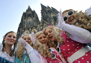 A picture dated 3 March 2011 shows german girls disguised in front of the cathedral in Cologne. On West German cities begun celebrating carnival tradition 'Conquest of City Hall' by women in disguise. Photo: Henning Kaiser dpa